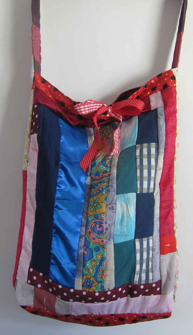 large image of art item: bag – quiltwork red blue with red ribbons