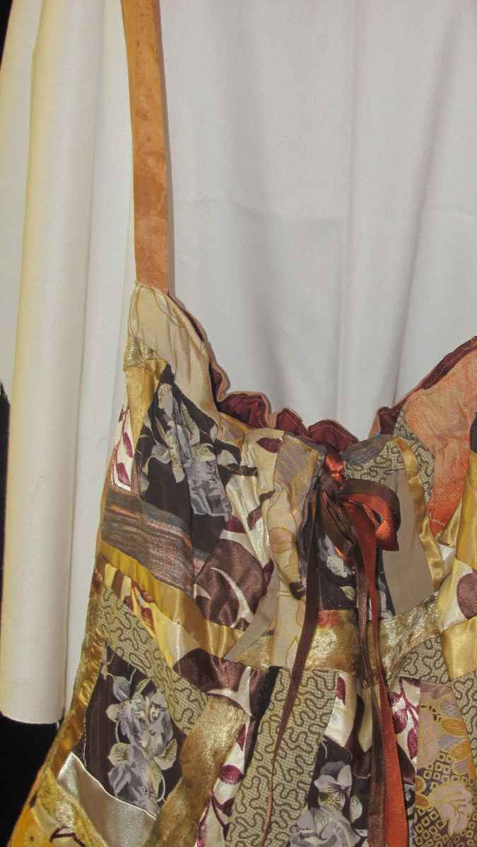 large image of art item: bag – quiltwork shades of brown with ribbon
