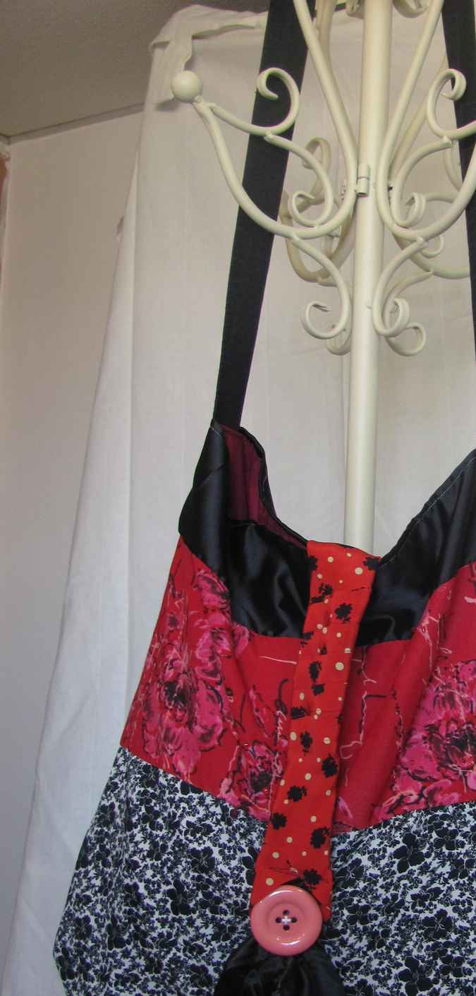 large image of art item: bag – red black white flower motif with pink button