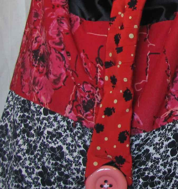 large image of art item: bag – red black white flower motif with pink button