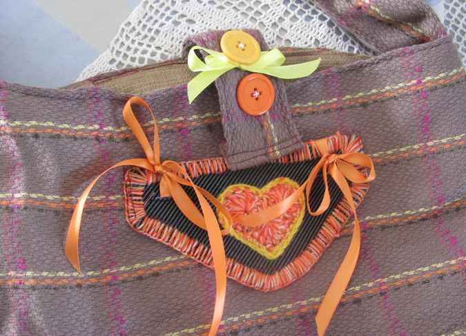 large image of art item: bag – stripes brown orange button ribbon