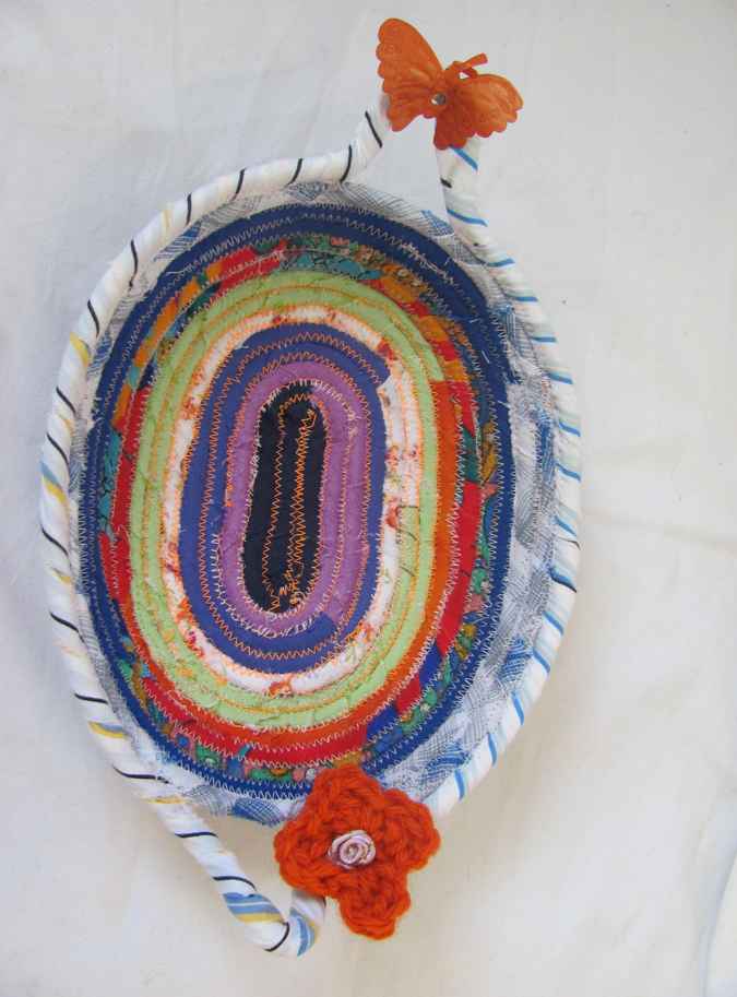 large image of art item: basket – small purple green blue with orange butterfly and flower