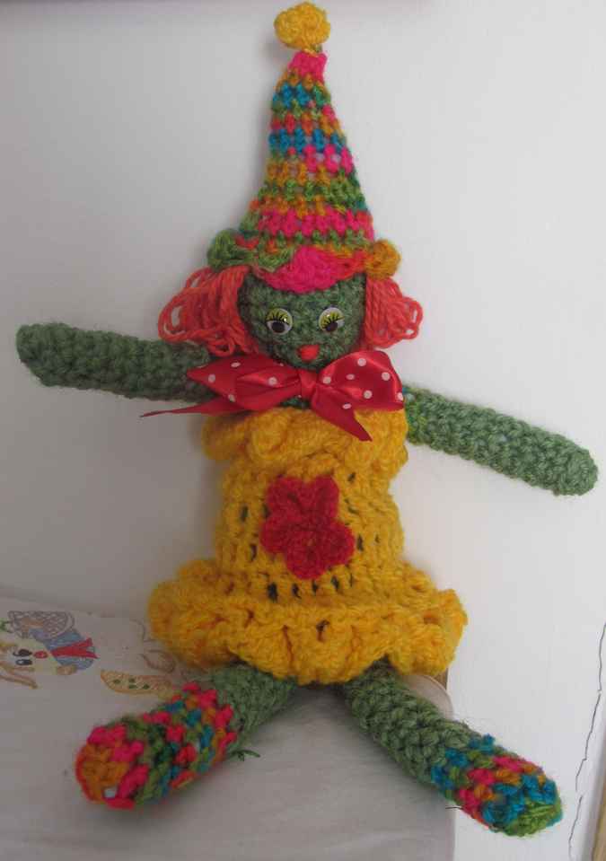 large image of art item: doll – clown yellow red colorful hat
