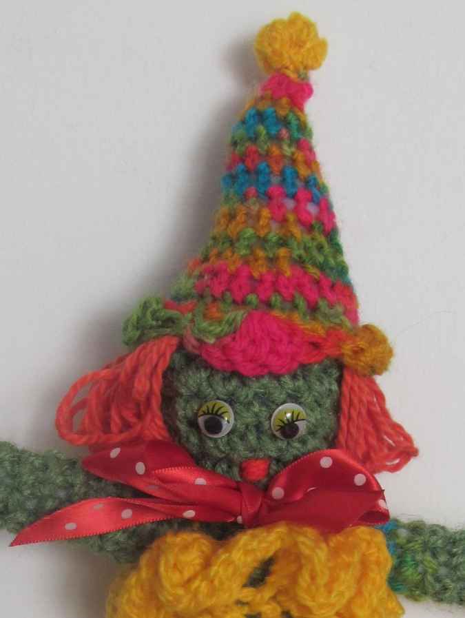 large image of art item: doll – clown yellow red colorful hat