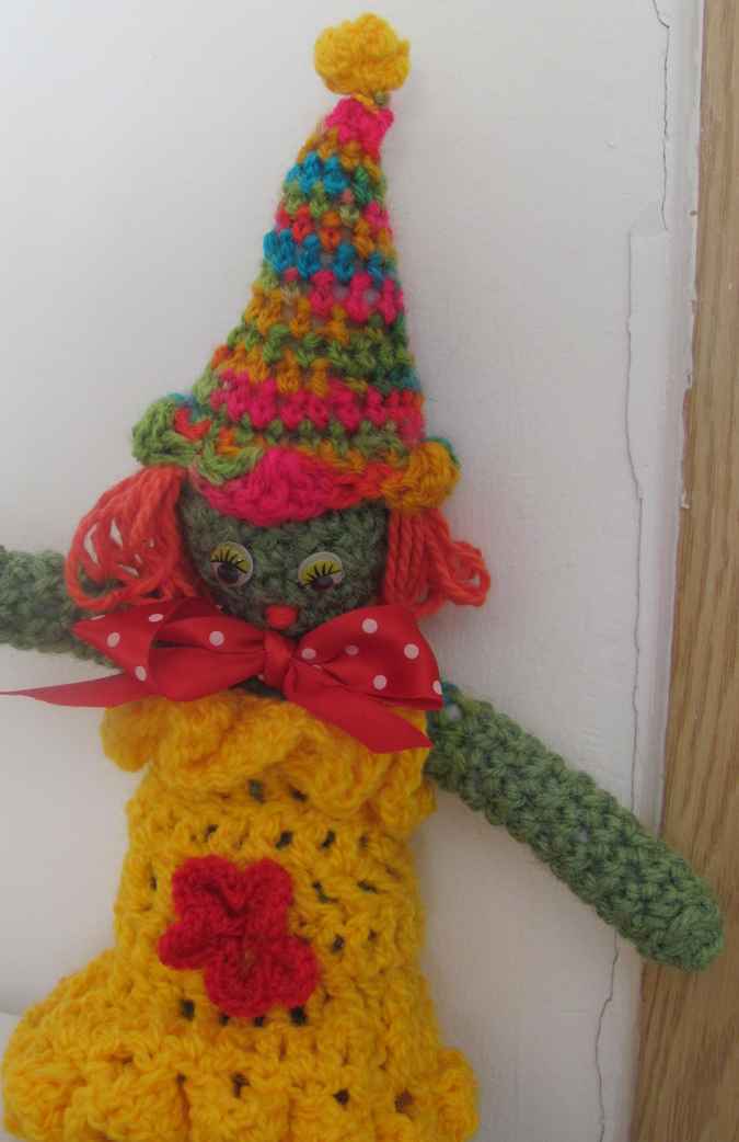 large image of art item: doll – clown yellow red colorful hat