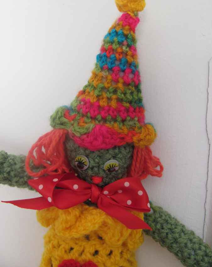 large image of art item: doll – clown yellow red colorful hat