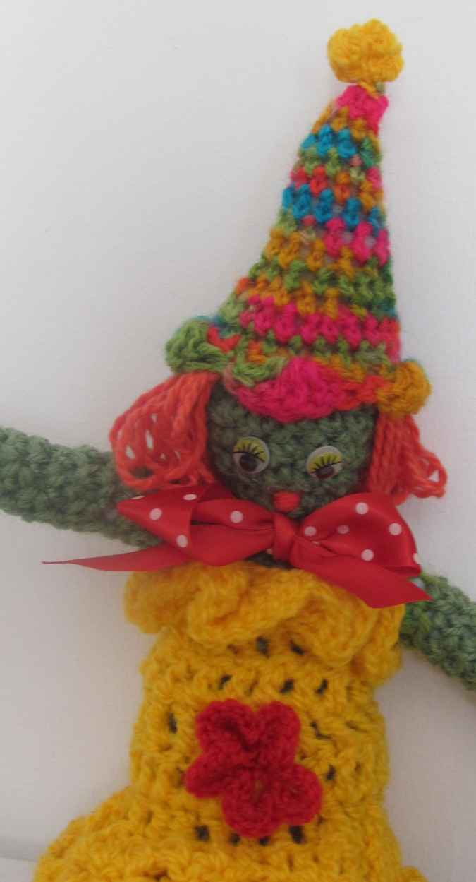 large image of art item: doll – clown yellow red colorful hat