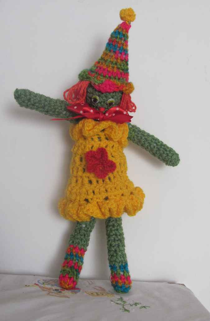 large image of art item: doll – clown yellow red colorful hat