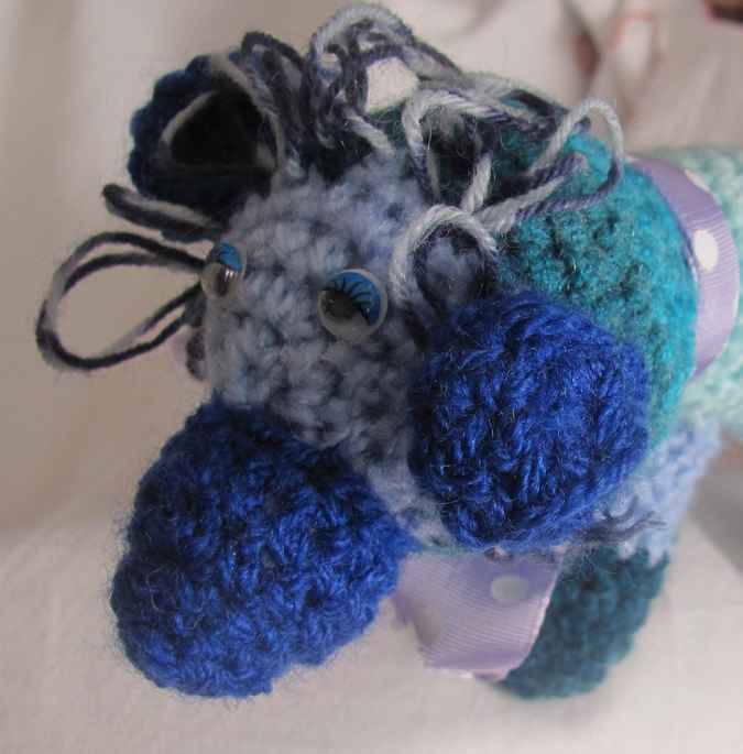 large image of art item: doll – dog cyan blues