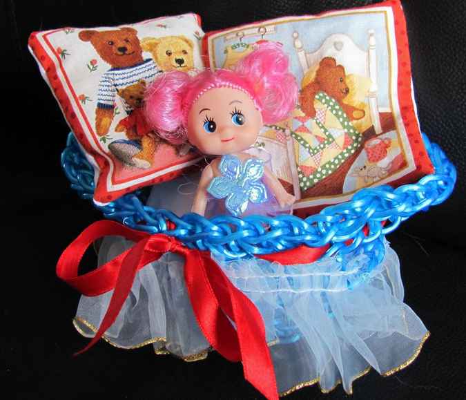 large image of art item: doll – doll with crocheted cradle