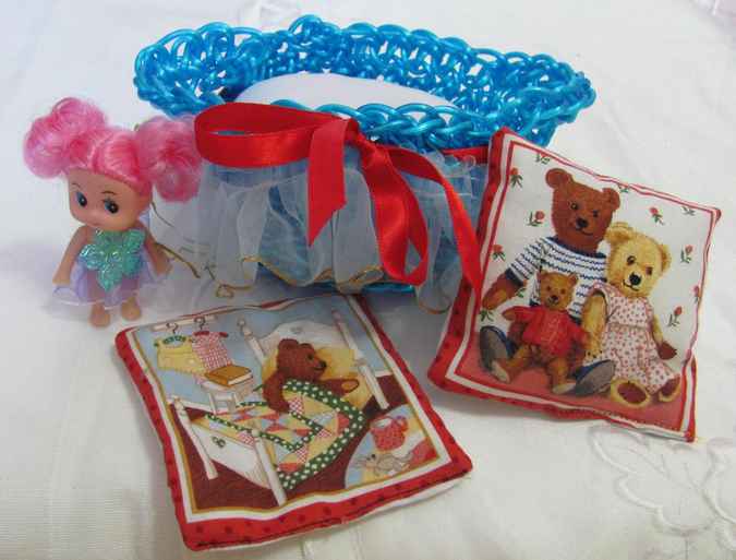 large image of art item: doll – doll with crocheted cradle