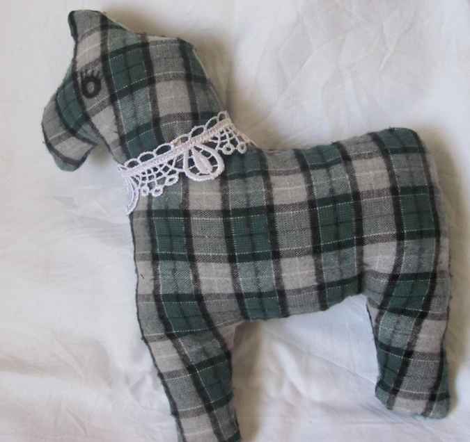 large image of art item: doll – horse checkered