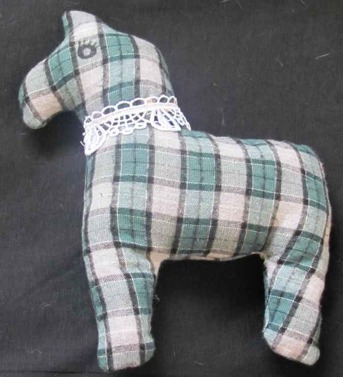 large image of art item: doll – horse checkered