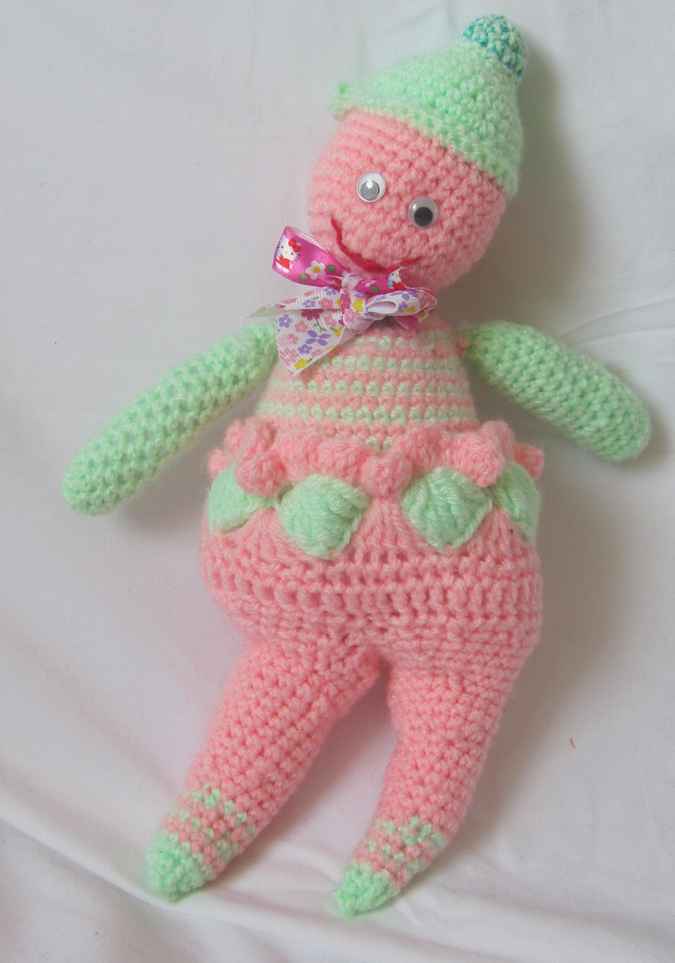 large image of art item: doll – pink green doll crochet