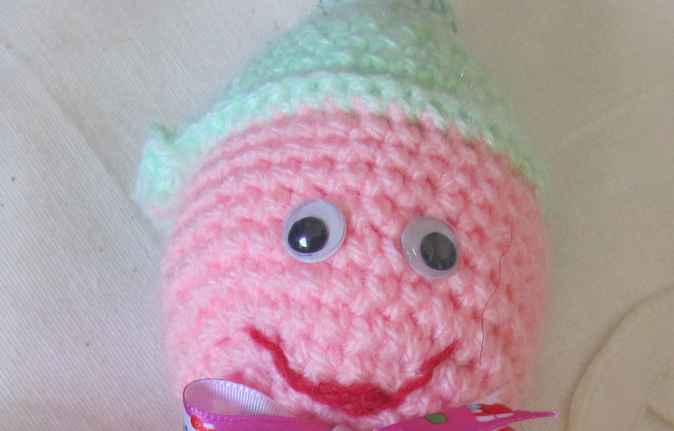 large image of art item: doll – pink green doll crochet