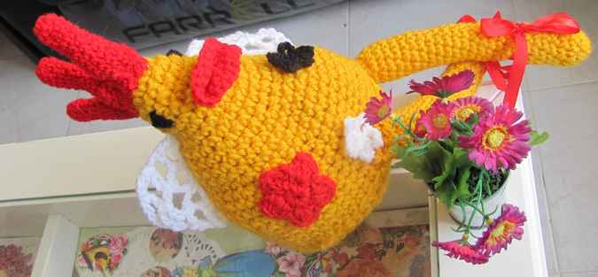 large image of art item: doll – rooster with flowers