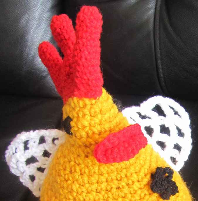 large image of art item: doll – rooster with flowers