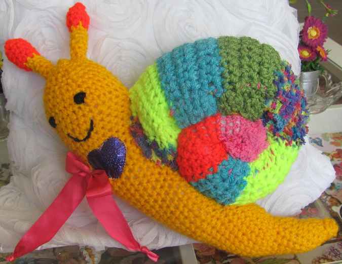 large image of art item: doll – snail crochet