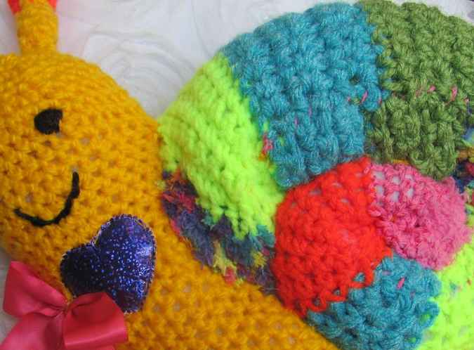 large image of art item: doll – snail crochet