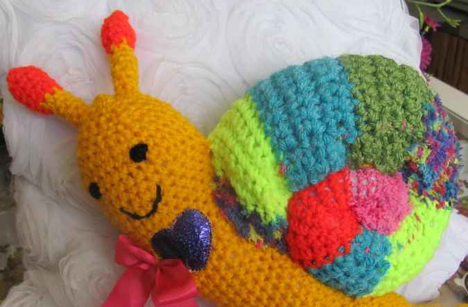 large image of art item: doll – snail crochet