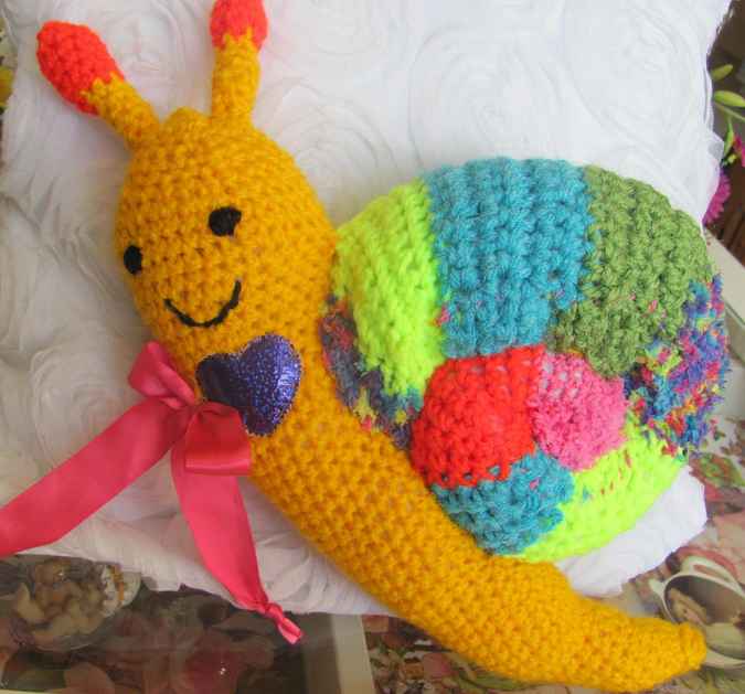 large image of art item: doll – snail crochet