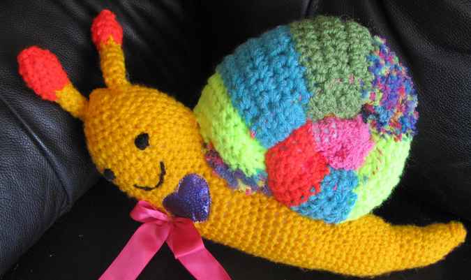 large image of art item: doll – snail crochet