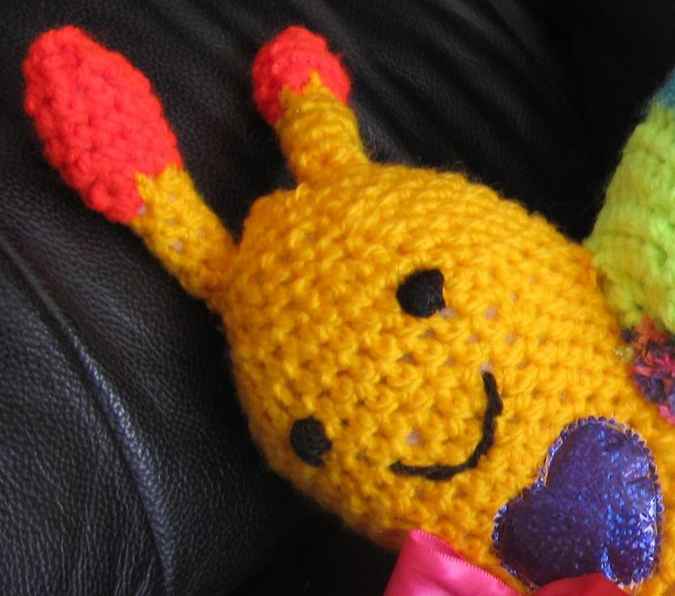 large image of art item: doll – snail crochet