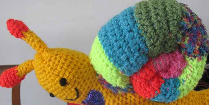 large image of art item: doll – snail crochet