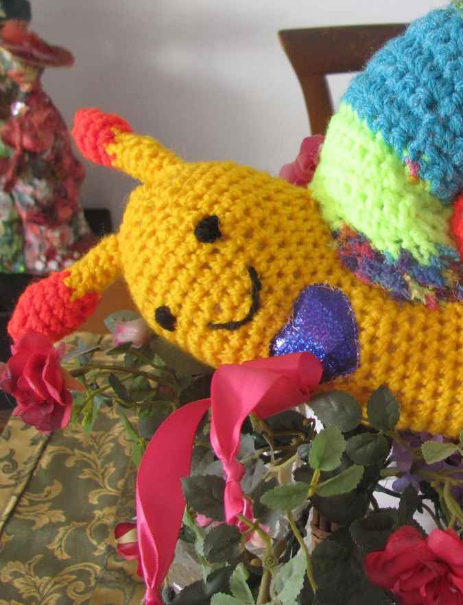 large image of art item: doll – snail crochet