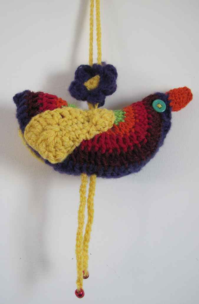 large image of art item: decor – bird crochet yellow red black
