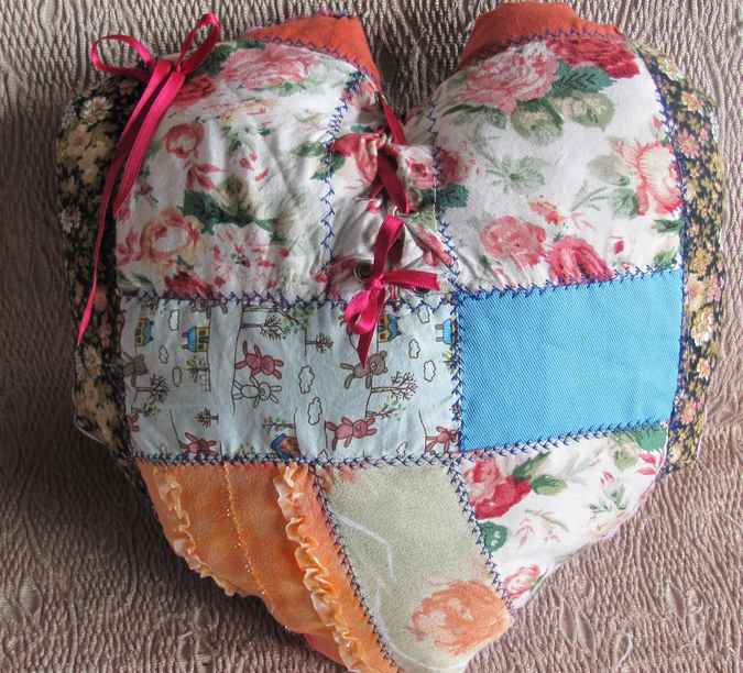 large image of art item: heart shaped quilted pillow with ribbon