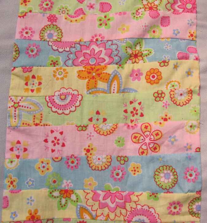 large image of art item: decor – quiltted baby blanket with flower motif